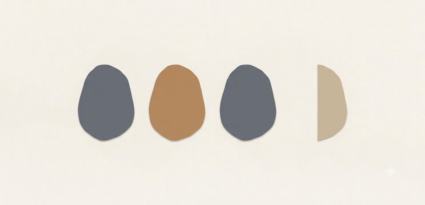 A calm sequence of evenly aligned slate stones with one subtly misaligned clay stone immediately catching the eye.